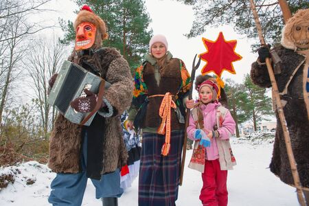 Russia. Tver region. The village "White Outside". January 7, 2020 Caroling in the village.National holidays and customs.  People with musical instruments are walking along a village street.のeditorial素材
