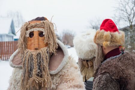 Russia. Tver region Village "White outside." January 7, 2020. Caroling in the village. National holidays and customs. The man in the ritual mask. Close-up photo.のeditorial素材