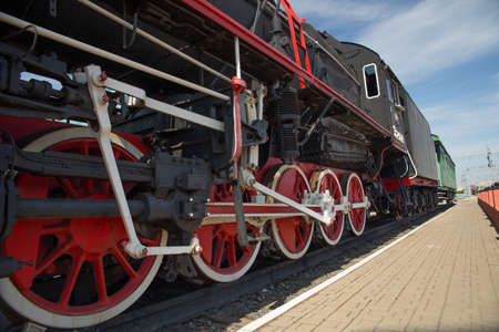 Wheels of an old steam locomotive. Large wheels, mechanical drive.の写真素材