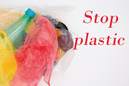 Plastic bags and bottles on a white background. Plastic environmental pollution concept.の写真素材