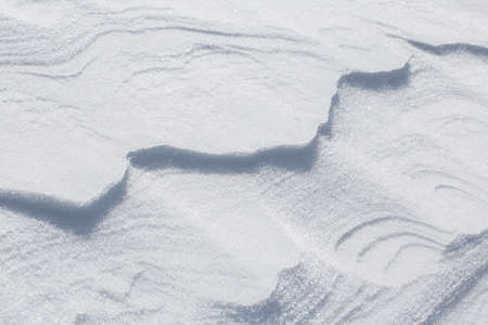 Natural snowy background. Natural snowy surface.