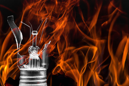 Flames on a black background. Broken incandescent lamp and glass shards.の写真素材