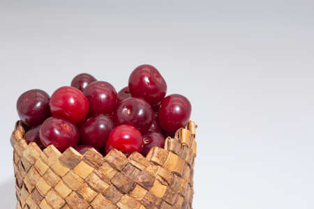 Cherry berries on a white background. Copy space.の写真素材