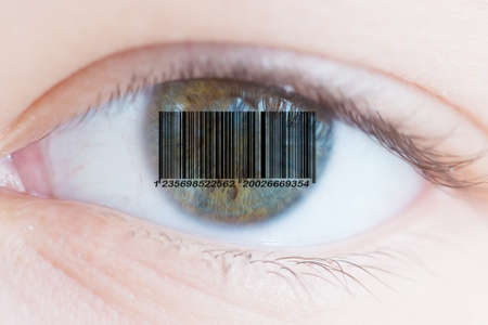 Barcode in the pupil of the human eye. The concept of personality identification by the iris of the eye.の写真素材