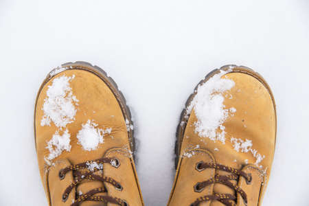 The boots are in the snow. Snow lies on the boots. Snowy weather concept.の写真素材