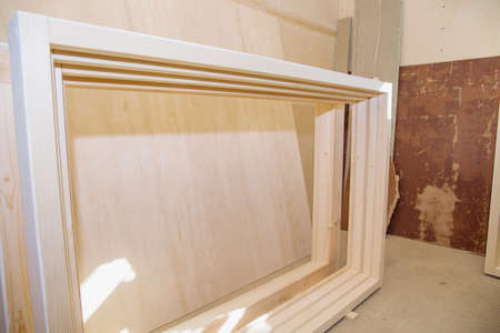 Wooden boxes for window frames are in a carpentry workshop.