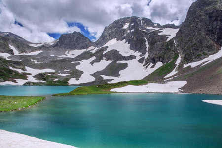 A beautiful alpine lake surrounded by mountains. soft focus.の写真素材
