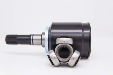 Constant velocity joint on a white background. The tripoid is the basis of the hinge.の写真素材