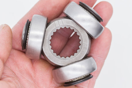 Three bearings in hand on a white background. Close-up.の写真素材
