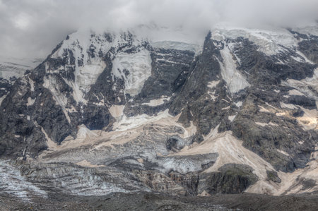 Top of a mountain with a glacier and snowfield.の写真素材