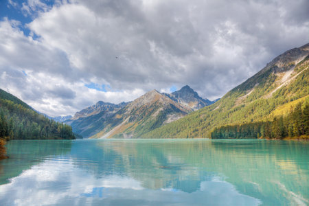 A beautiful lake surrounded by mountains.の写真素材