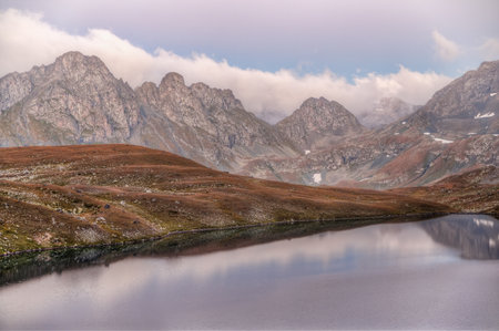 The lake is surrounded by high mountains. Clean water of mountain lakes.の写真素材