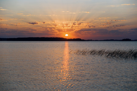 Evening sunset on the lake.の写真素材