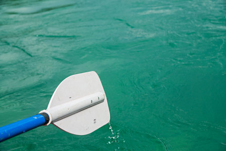 Paddle against the background of river water. soft focus.