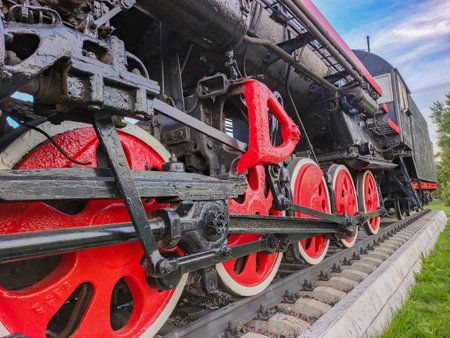The undercarriage of an old steam locomotive