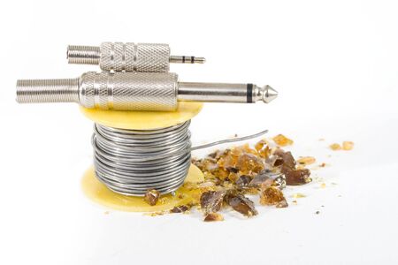 tools for soldering: resin, spoons of tin wire, two jacksの写真素材