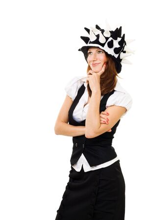 Young confident woman in party hat thinking and reasoning isolated on whiteの写真素材