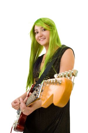 Creative woman guitarist with color green hair and electric guitar isolated on whiteの写真素材