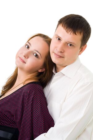 Positive young couple looiking at camera smiling, isolated on whiteの写真素材