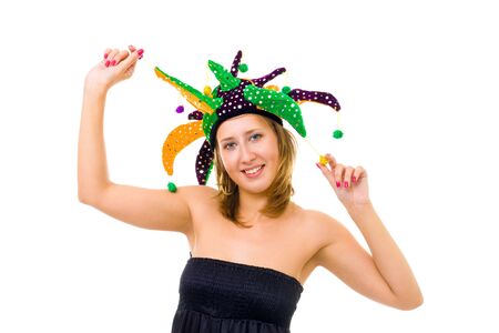 Woman in funny cap with bells make a fool smiling and looking at cameraの写真素材