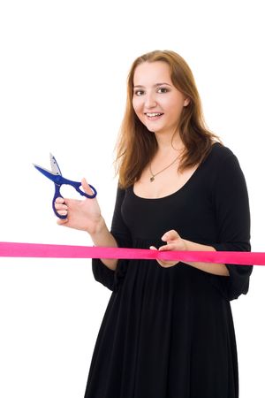 Woman cutting a red ribbon for a ceremony isolated on whiteの写真素材