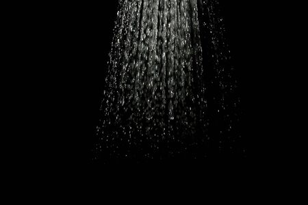 Whater drops falling isolated on blackの写真素材