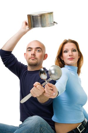 Couple share cooking - sitting and holding soon,casserole,ladle.の写真素材