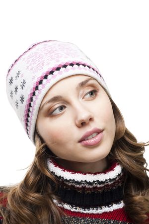 Woman in winter cap look with interest aside,isolated on white
