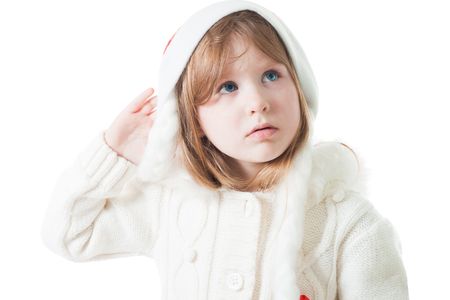 Cute little girl in new year cap with misunderstanding lookの写真素材