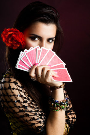 Gypsy woman with fan of cards and mysterious lookのeditorial素材