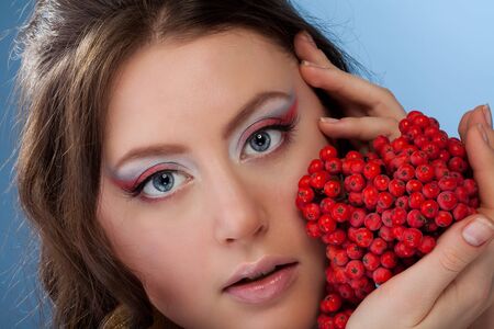 Beauty shoot of a woman with rowan berryの写真素材