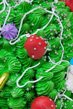 Cake decorations - color cream, caramel, icing and Christmas figuresの写真素材