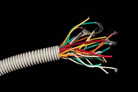 torn apart cable isolated on black background