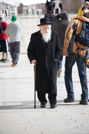 Jerusalem, Old city, Jewish quarter, Israel, January 05, 2011: Old orthodox Jewish man with walking stick near the Western Wall in Old cityのeditorial素材