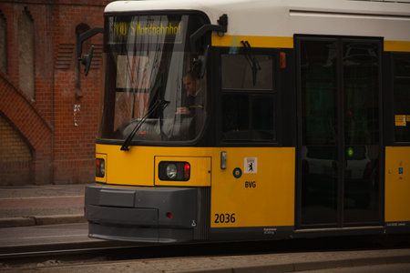 Berlin, Germany, March 05, 2011: Yellow electric tram near to  Warschauer StraÃe U-bah train stationのeditorial素材