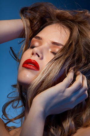 Beauty shoot of young woman expressing positivity and pleasureの写真素材