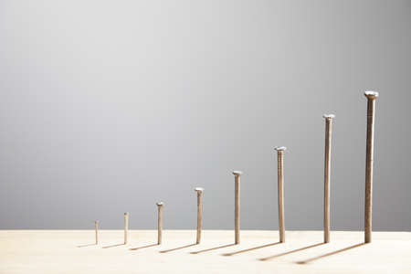 Chart made of nails growing in size and heightの写真素材