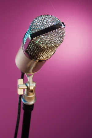 beautiful microphone on pink background