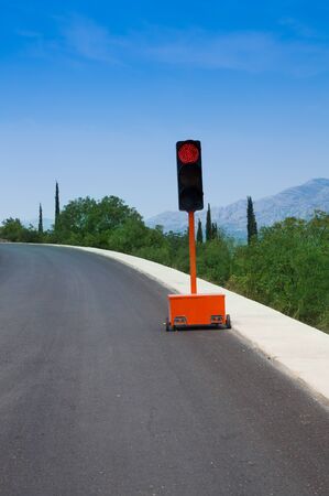 Portable traffic light on Croatian road construction