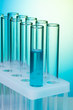 Laboratory equipment - test tubes in blue scientific looking light - close-upの写真素材