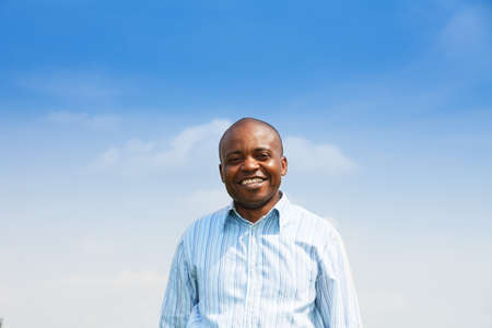 Portrait of happy black adult man with big toothy smile