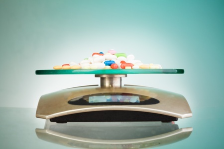 Weights with precious drugs measuring precise massesの写真素材