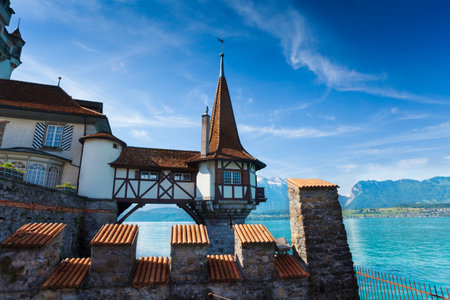 Oberhofen Switzerland view on the tower in the water from forts wallsのeditorial素材