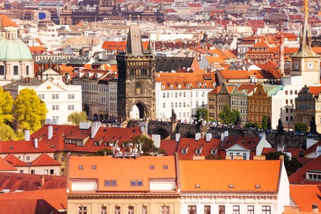 Panoraa of Prague downtown with red roofs and Charles bridge over Vlatavaの写真素材