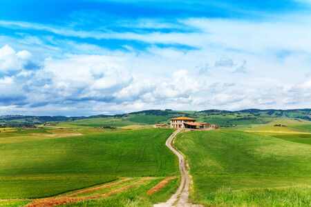 Tuscany landscape with house and footpath in  Italyの写真素材