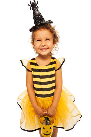 Little bee costume with candy Halloween bucket の写真素材