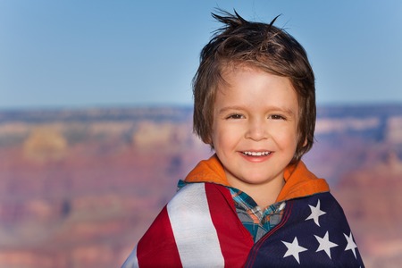 Boy with Grand Canyon National Park and USA flagの写真素材