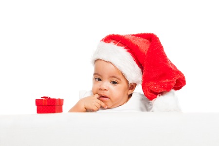 African baby paci finger wearing red Christmas hatの写真素材