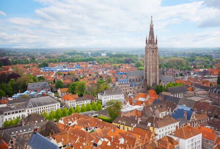 Cityscape with church of Our Lady Bruges view from top during summer in Belgiumの写真素材