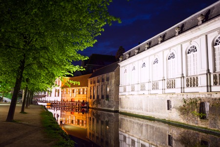 Groenerei canal with trees at night in Bruges, Belgiumの写真素材